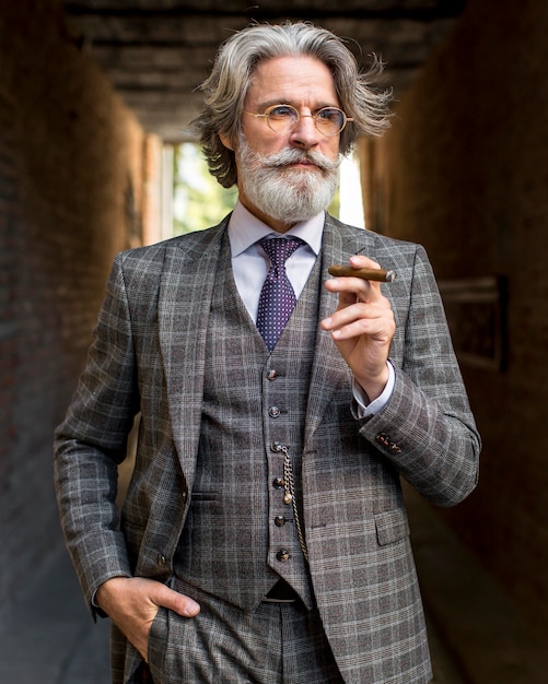 Portrait of mature man smoking cuban cigar