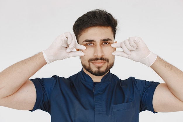 Free photo a portrait of a medical doctor posing against white background