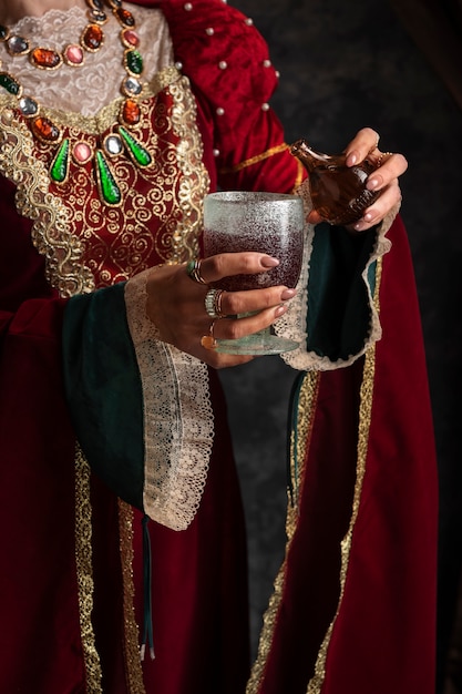 Free photo portrait of medieval queen with chalice and poison