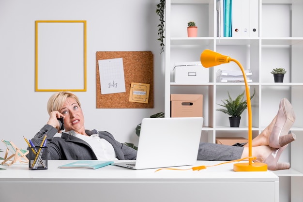 Free photo portrait of middle aged businesswoman in office