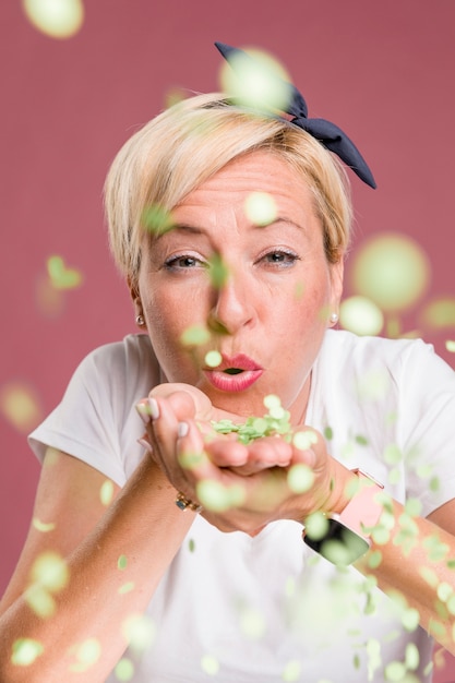 Free Photo portrait of middle aged woman in celebration pose