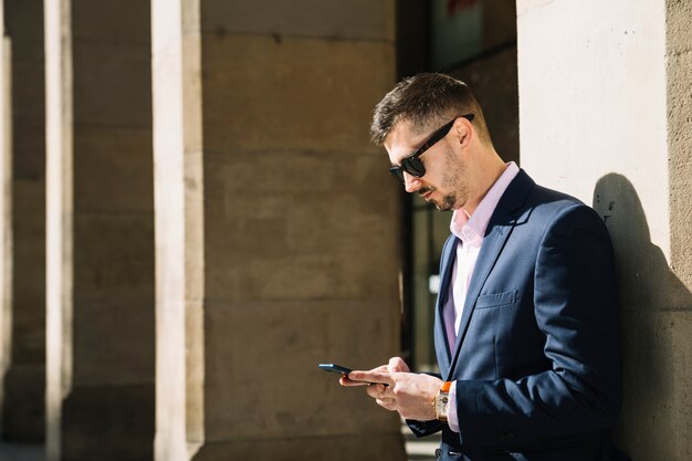 Portrait of modern businessman outdoors