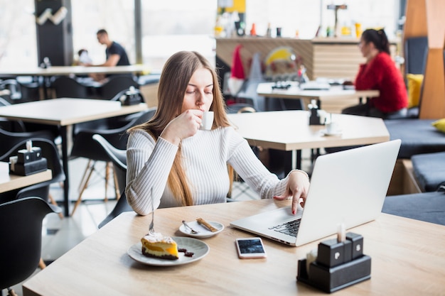 Free Photo portrait of modern woman working with laptop