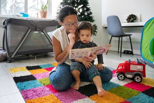 Portrait of mother and child reading together