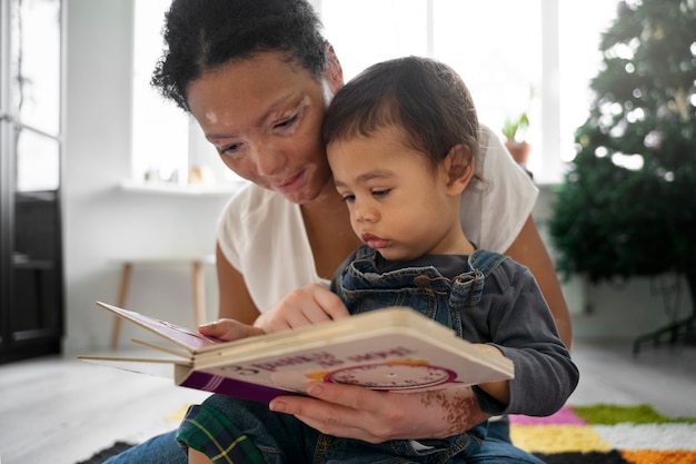 Portrait of mother and child reading together