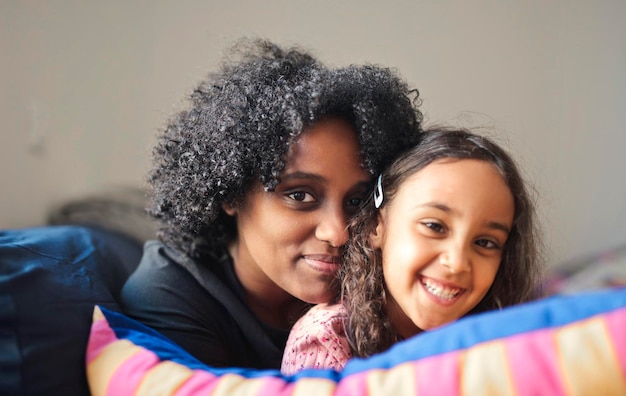 Free photo portrait of mother and daughter embraced