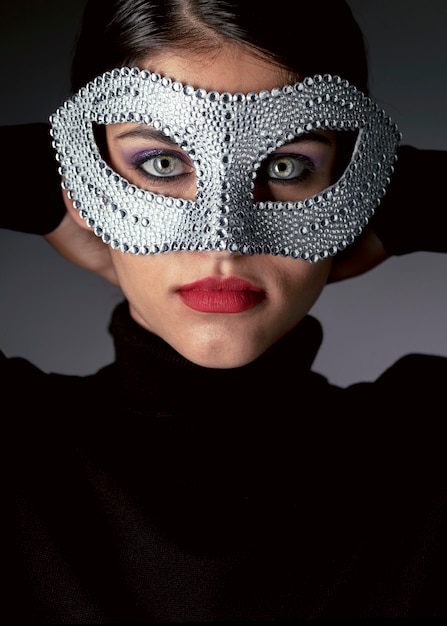 Free Photo portrait of mysterious woman with carnival mask