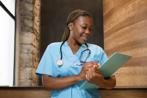 Portrait of nurse in scrubs at the clinic