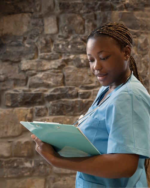 Portrait of nurse in scrubs at the clinic