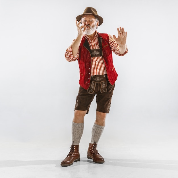 Portrait of Oktoberfest man, wearing the traditional Bavarian clothes