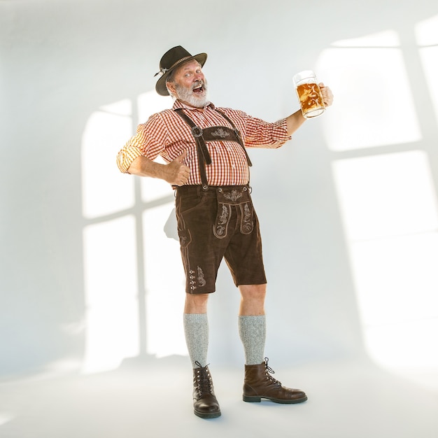 Portrait of Oktoberfest man, wearing the traditional Bavarian clothes