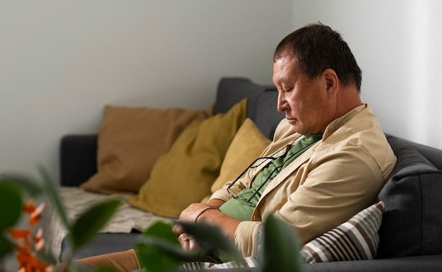 Portrait of older man resting at home