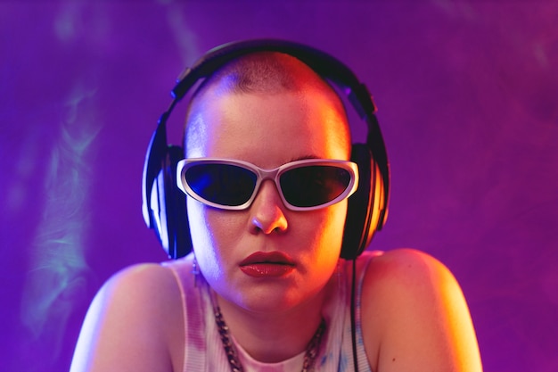 Free photo portrait of person attending a vibrant techno music party