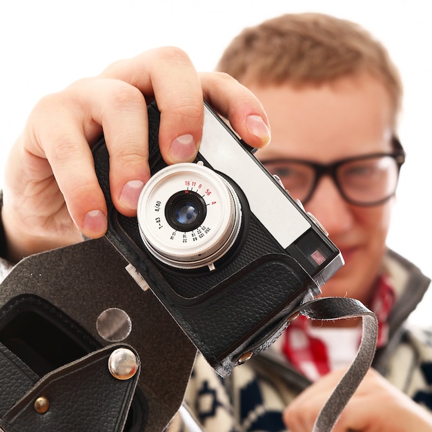 portrait of a photographer man with retro camera