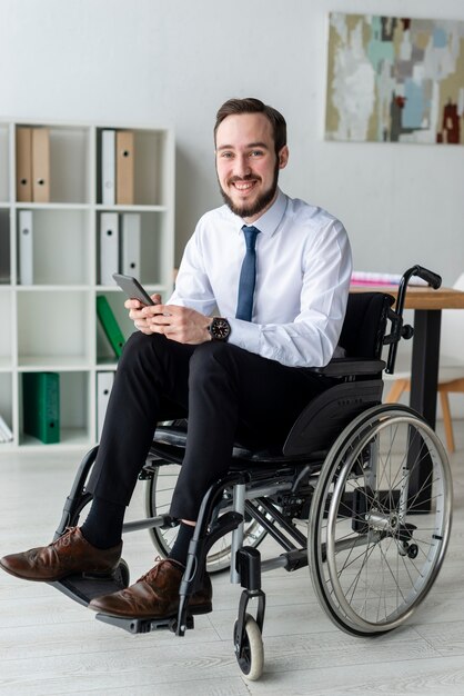 Portrait of positive adult man at the office