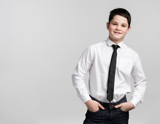 Portrait of positive young kid posing