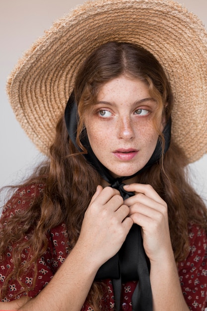 Portrait of pretty woman with straw hat