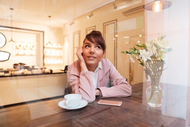 Portrait of a pretty young woman sitting