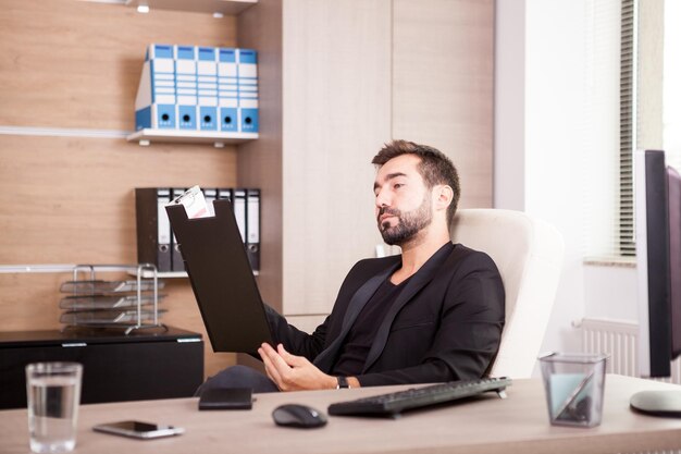 Free photo portrait of professional businessman working in his office. businessperson in professional environment