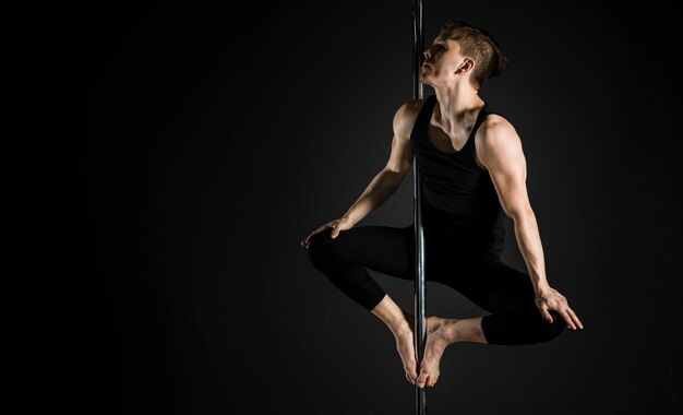 Portrait of professional pole dancer male