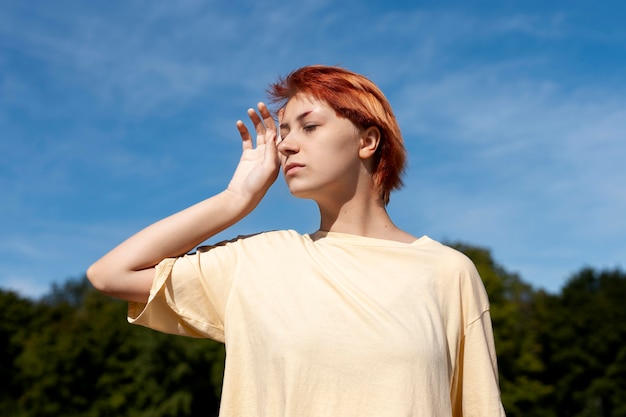 Free Photo portrait of redhead girl outdoors