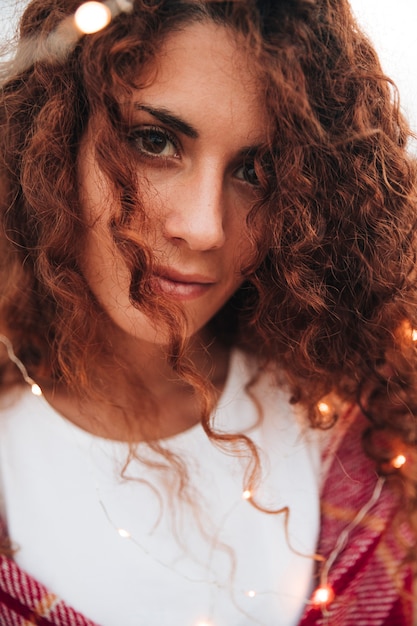 Free Photo portrait of a redhead woman with a scarf