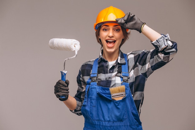 Portrait of repairer woman with painting roller isolated