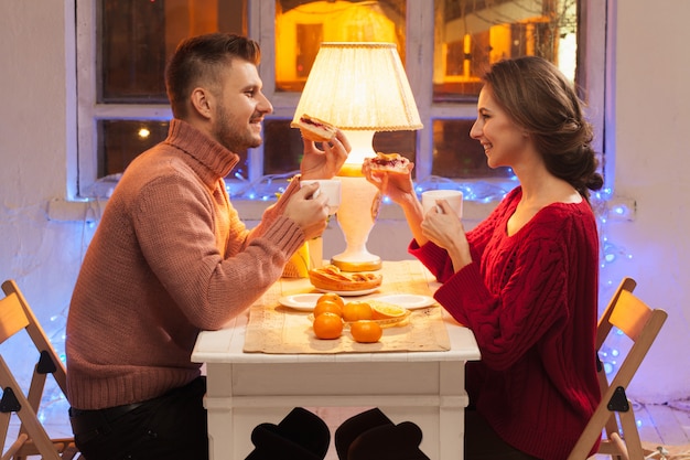 Portrait of romantic couple at Valentine's Day dinner with candles