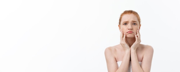 Portrait sad serious young woman with disappointed facial expression isolated on white background lo