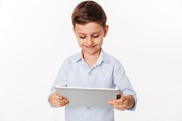 Portrait of a satisfied cute little kid playing games