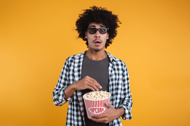 Portrait of a scared afro american man in 3d glasses