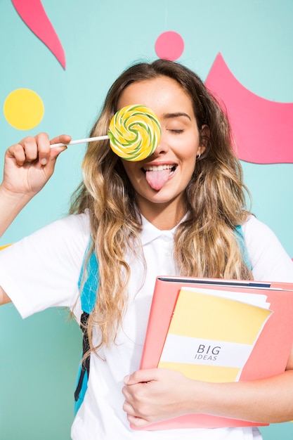 Portrait of schoolgirl on memphis style background