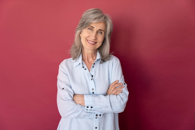 Portrait of senior gray-haired smiley woman