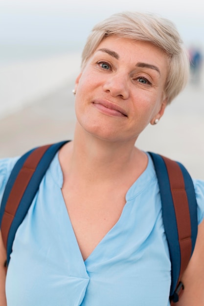 Portrait of senior tourist woman at the beach