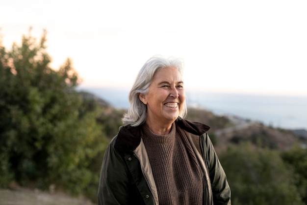 Portrait of senior woman out for an adventure in nature