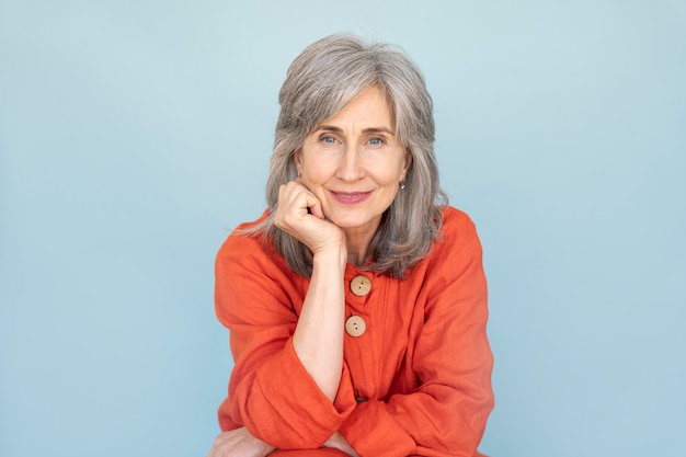 Portrait of senior woman wearing red shirt