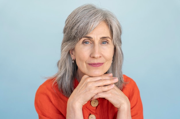 Portrait of senior woman wearing red shirt