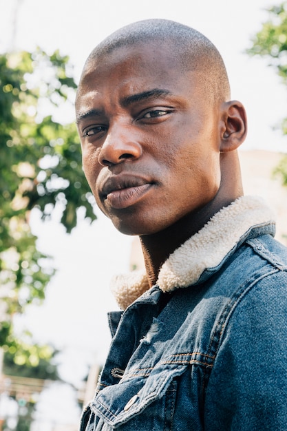 Portrait of a shaved young man looking at camera