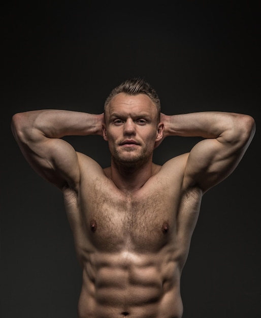 Free photo portrait of shirtless muscular guy isolated on grey background