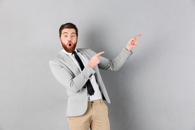 Portrait of a shocked businessman dressed in suit