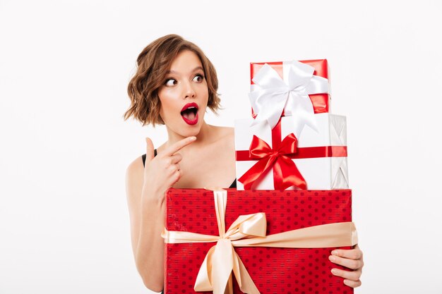 Portrait of a shocked girl dressed in black dress