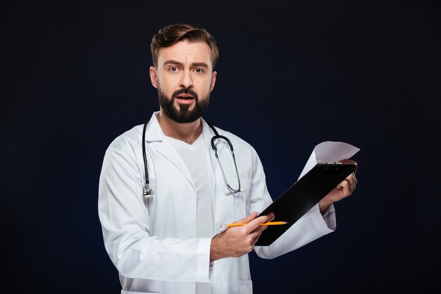 Portrait of a shocked male doctor