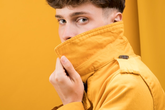 Portrait of shy fashionable boy