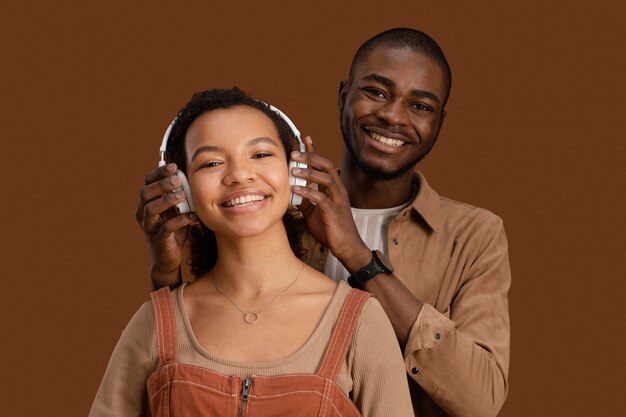 Portrait of smiley couple with headphones