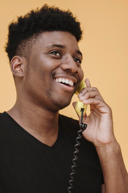 Portrait of smiley man talking on the phone