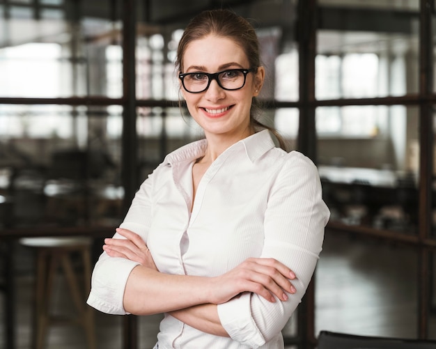 Free Photo portrait of smiley professional businesswoman indoors