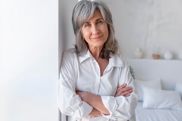 Portrait of smiley senior woman relaxing at home