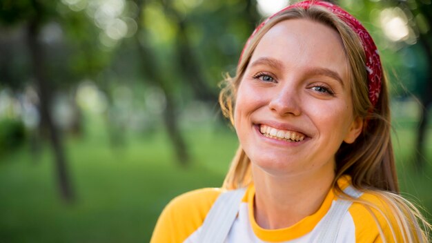 Portrait of smiley woman outdoors