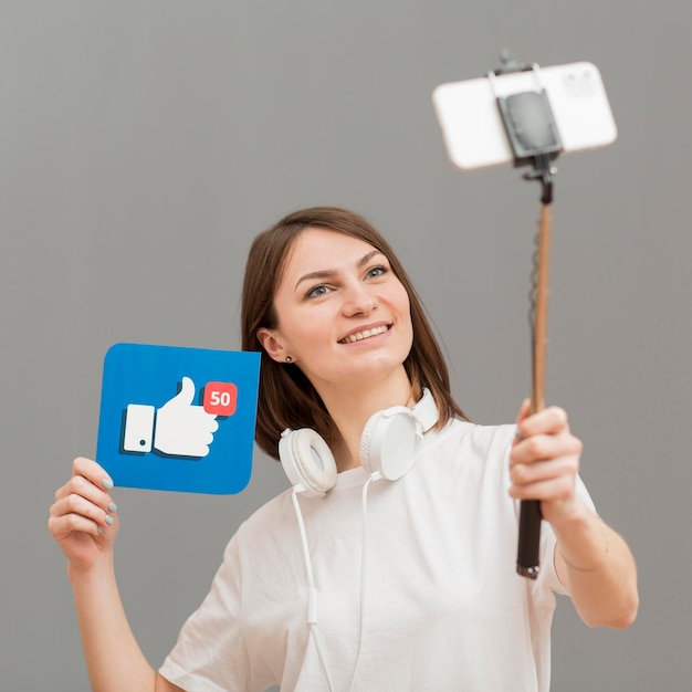 Free Photo portrait of smiley woman recording herself