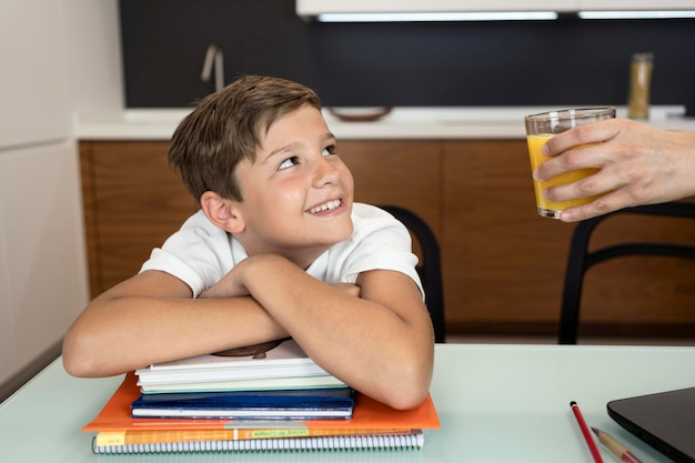 Portrait of smiley young boy looking at his mother